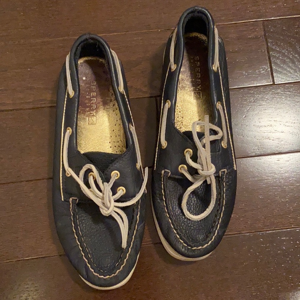 Navy speedy boat shoes with gold insides